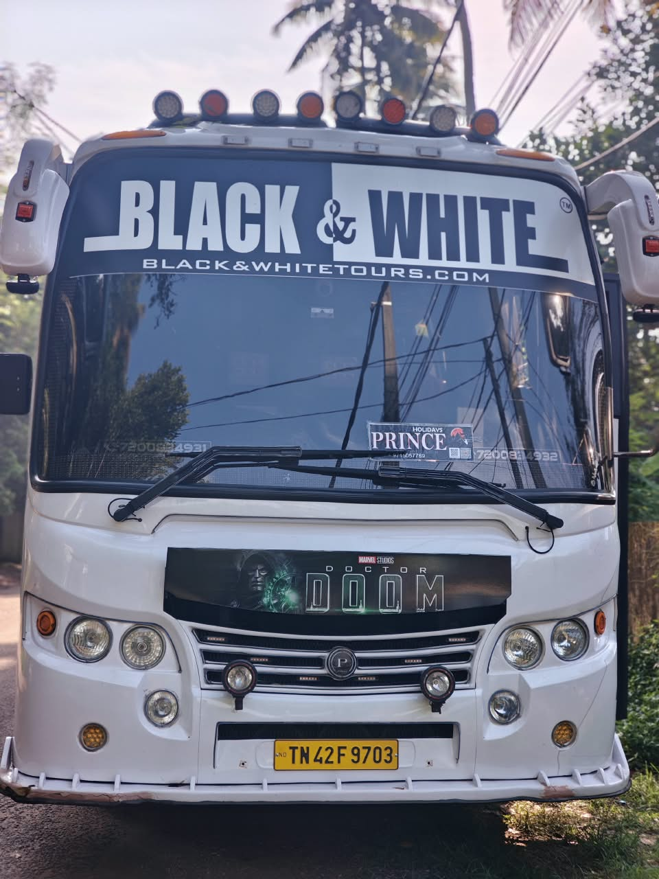 Real luxury tourist coach front on a scenic mountain road